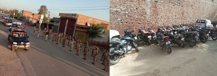 फ्लैग मार्च करती पुलिस और पिछले दिनों दौरान बंद किये मोटर सायकल